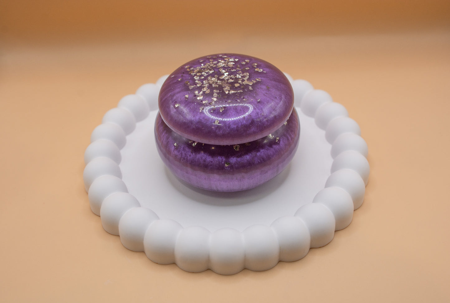 A metallic purple coloured trinket pot made with ashes and resin