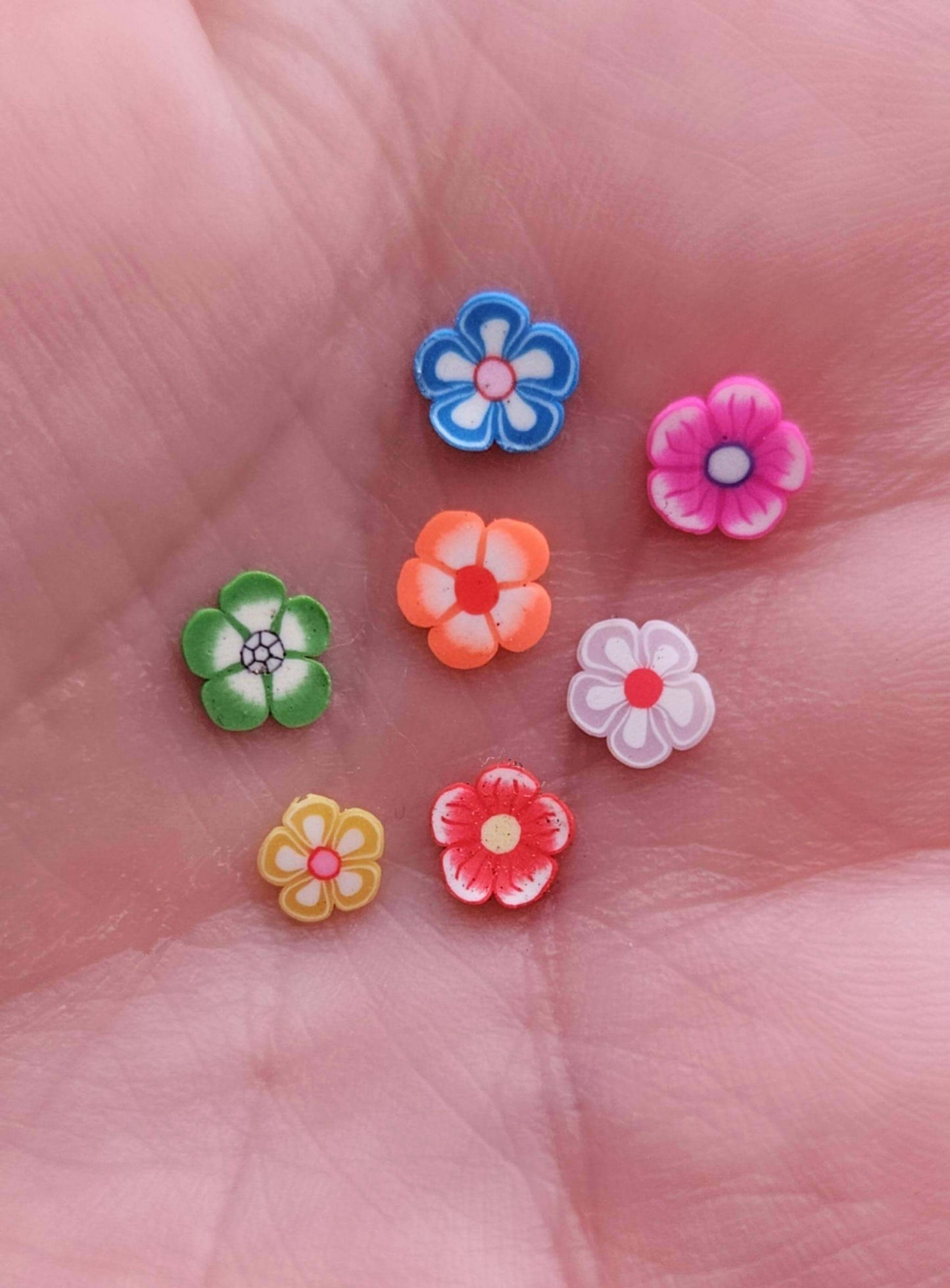 Image showing all the colours of flower inclusions that can go into the rectangle ashes memorial keyring