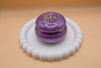 A metallic purple coloured trinket pot made with ashes and resin